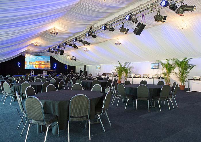 Inside the 15m marquee is lined and has a timber and carpet floor
